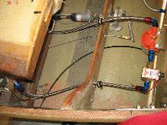 Fram filter and Facet pump with steel braided hoses hooked up. Header tank on left. Scott brake cylinder and Strong pitch trim motor also visible at top. IMG_0395a.jpg